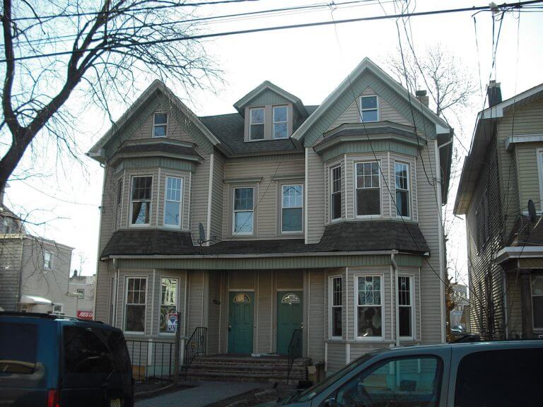 Multi-family house inspected by Checkmark Plus: gray with gables