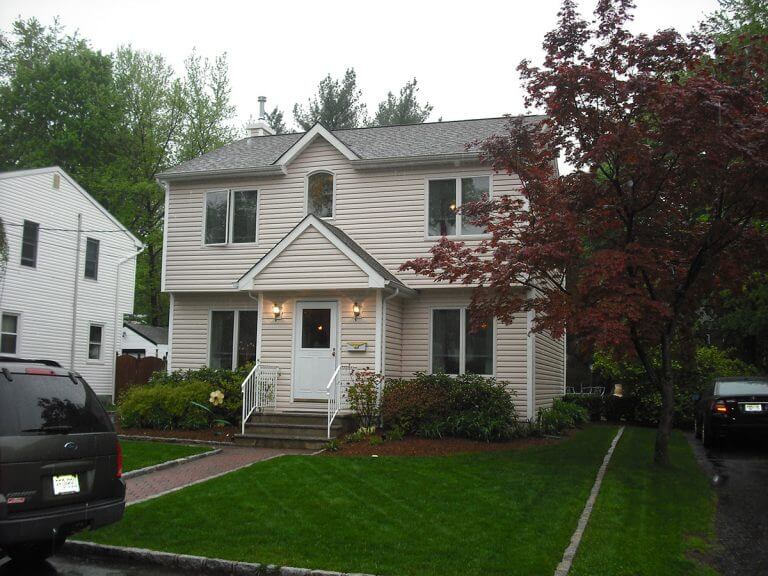 Single-family home inspected by Checkmark Plus: white cape