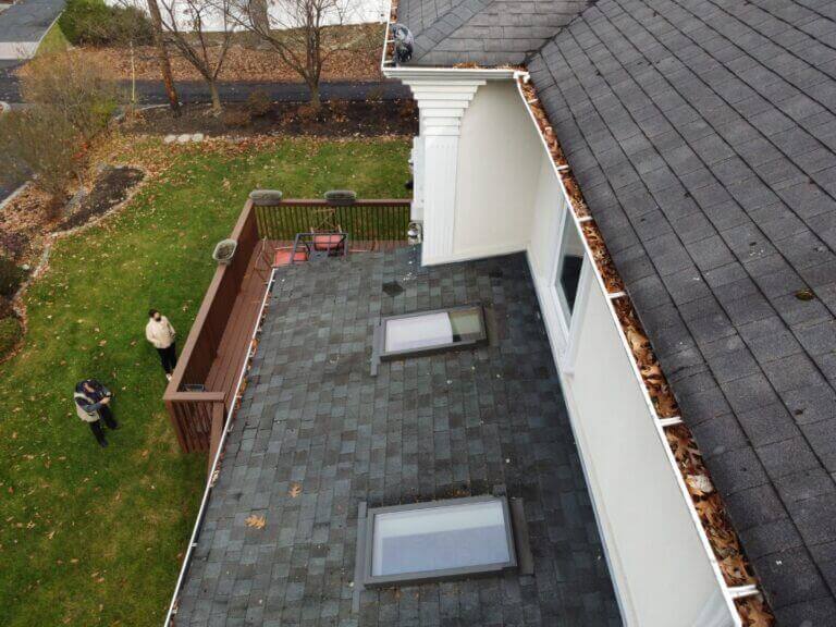 Roof inspection: skylights on a dark shingle roof