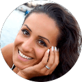 Google reviewer photo, smiling woman resting her chin on her hand